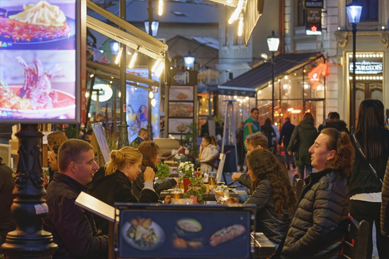 4 - A bustling al fresco dining scene at night in Bucharest
